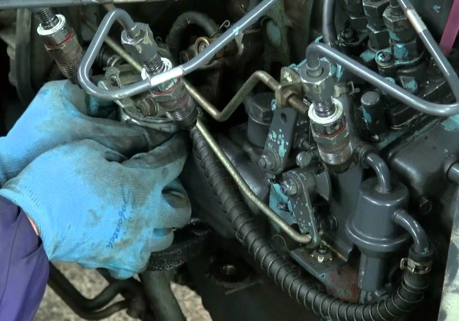 Man working on engine fuel system
