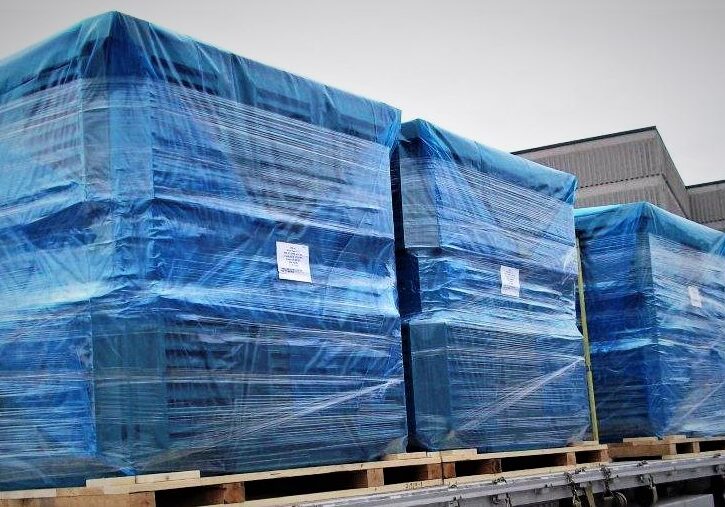 Transport truck loaded with pallets packaged in vci corrosion prevention blue film